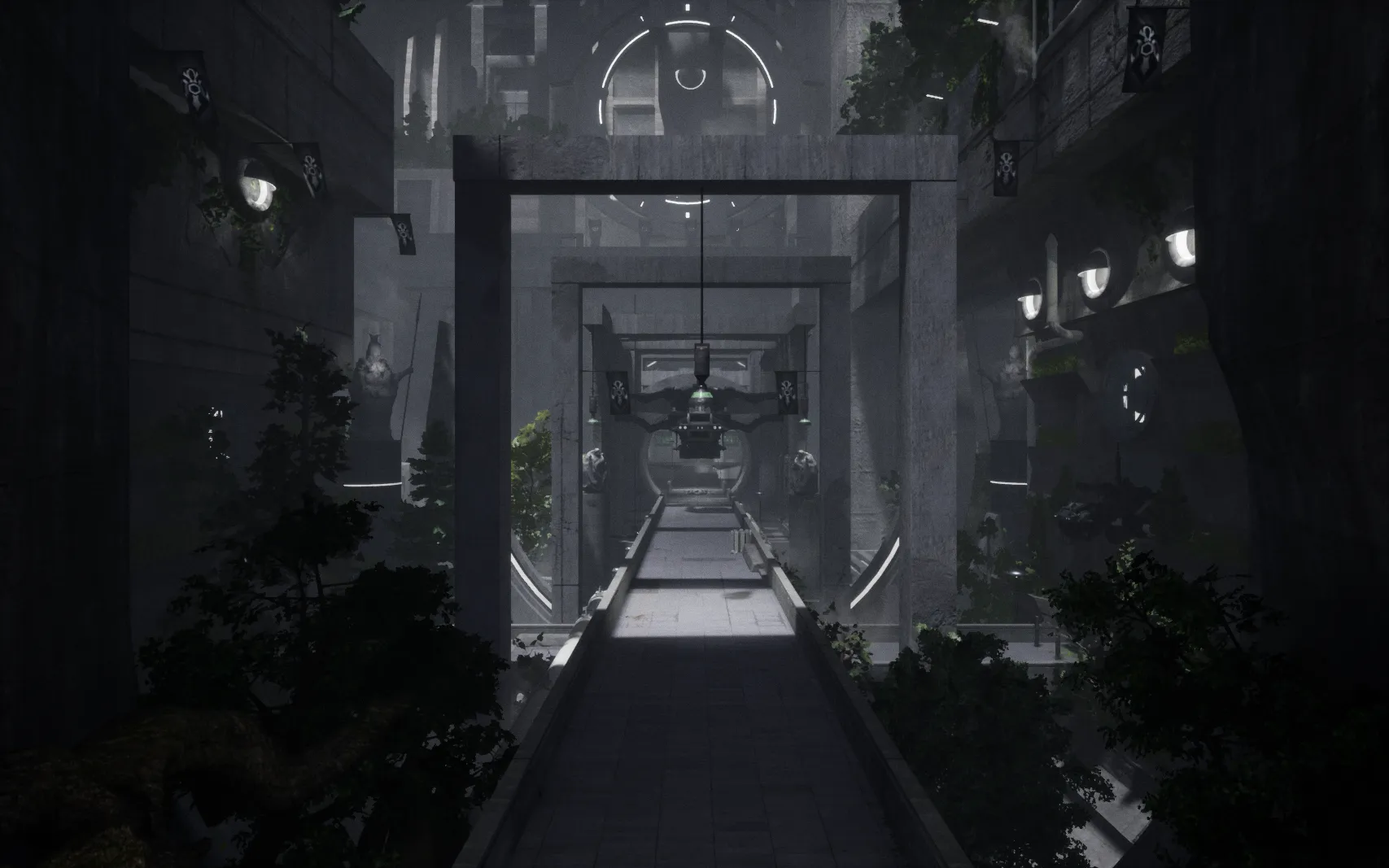 A person looks down a bleak, grey corridor